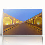 Art deco poster depicting a Middle Eastern scenery in muted earth tones on a white framed acrylic.