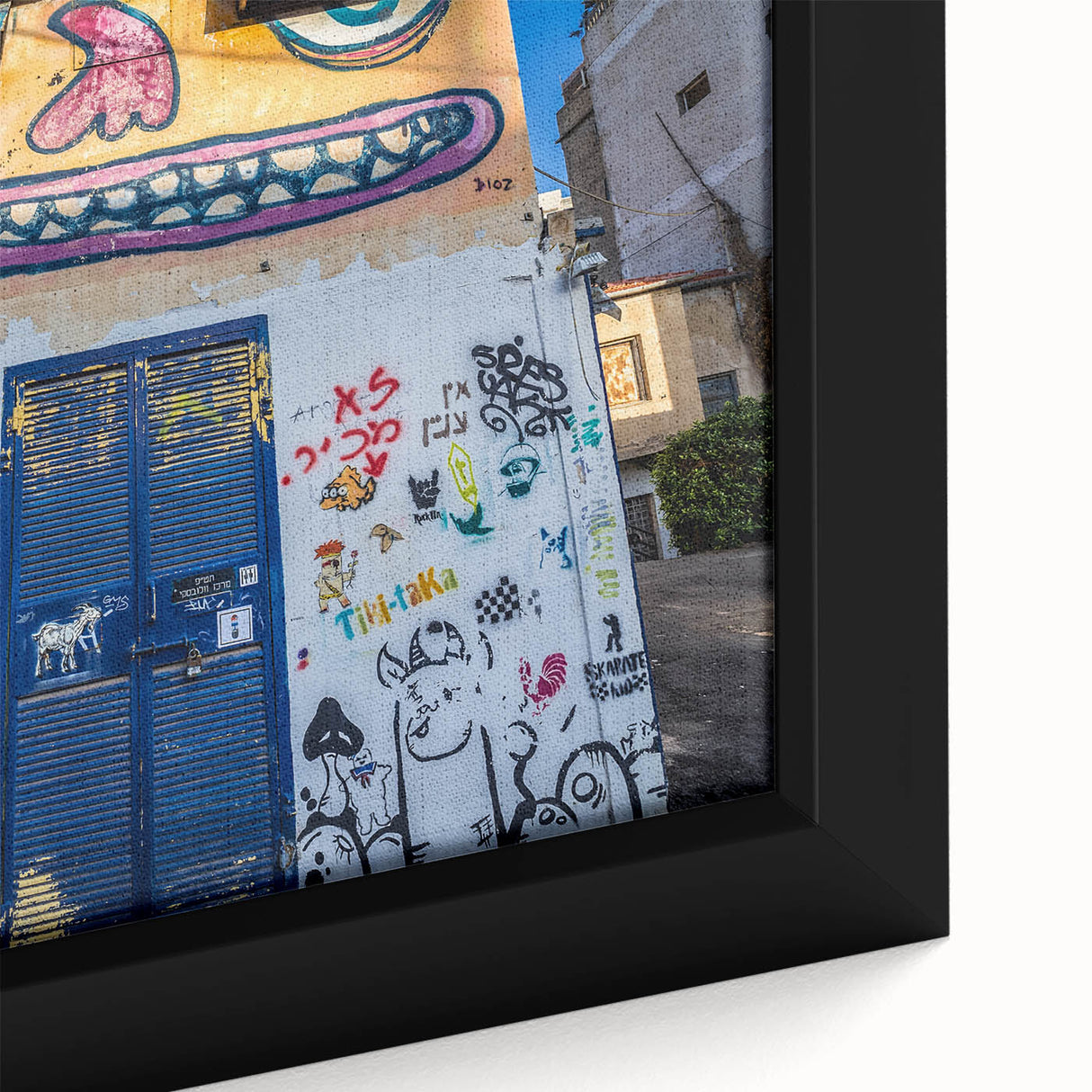 Extra large framed canvas featuring a textured, colorful Tel Aviv cityscape on a black background.