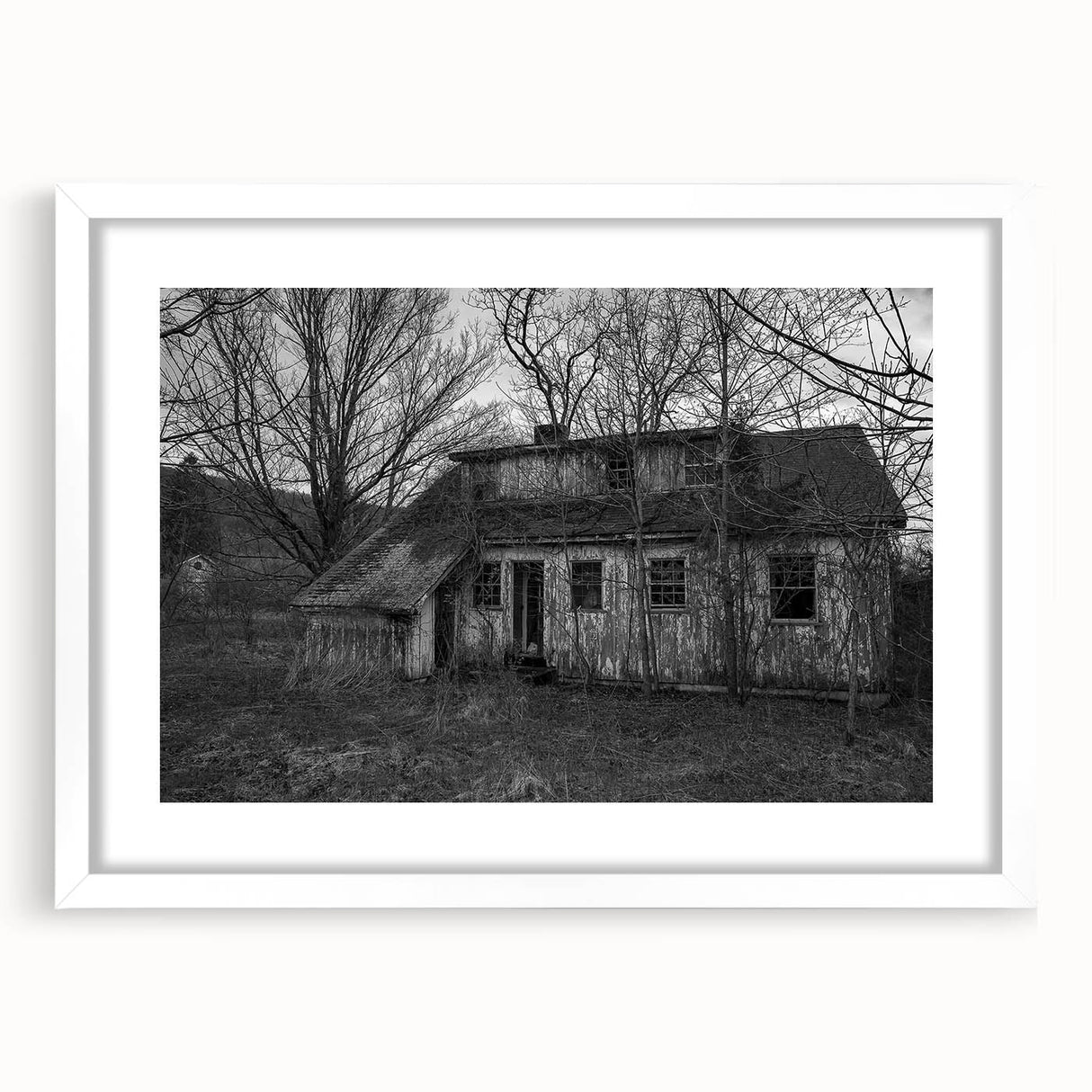 Abstract art print of Delaware scenery in muted earth tones, framed with a white mat, suitable for dining room decor.