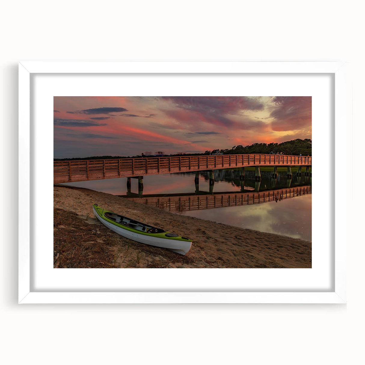 Abstract art print of Maine scenery in muted blue and green tones on a framed white mat, suitable for dining room decor.
