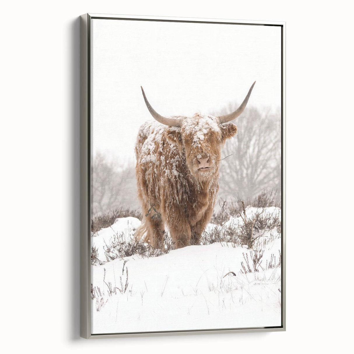 Framed canvas depicting a winter landscape scene in muted blues and whites, ideal for living room decor.