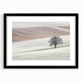 Abstract landscape frame with a sleek black mat, showcasing a vibrant, colorful scene of rolling hills and a sunset, perfect for modern home decor.