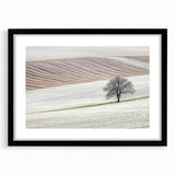 Abstract landscape frame with a sleek black mat, showcasing a vibrant, colorful scene of rolling hills and a sunset, perfect for modern home decor.