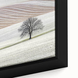 Close-up of a framed abstract landscape canvas artwork showcasing vibrant blues, greens, and earthy tones, perfect for modern home decor or office spaces.