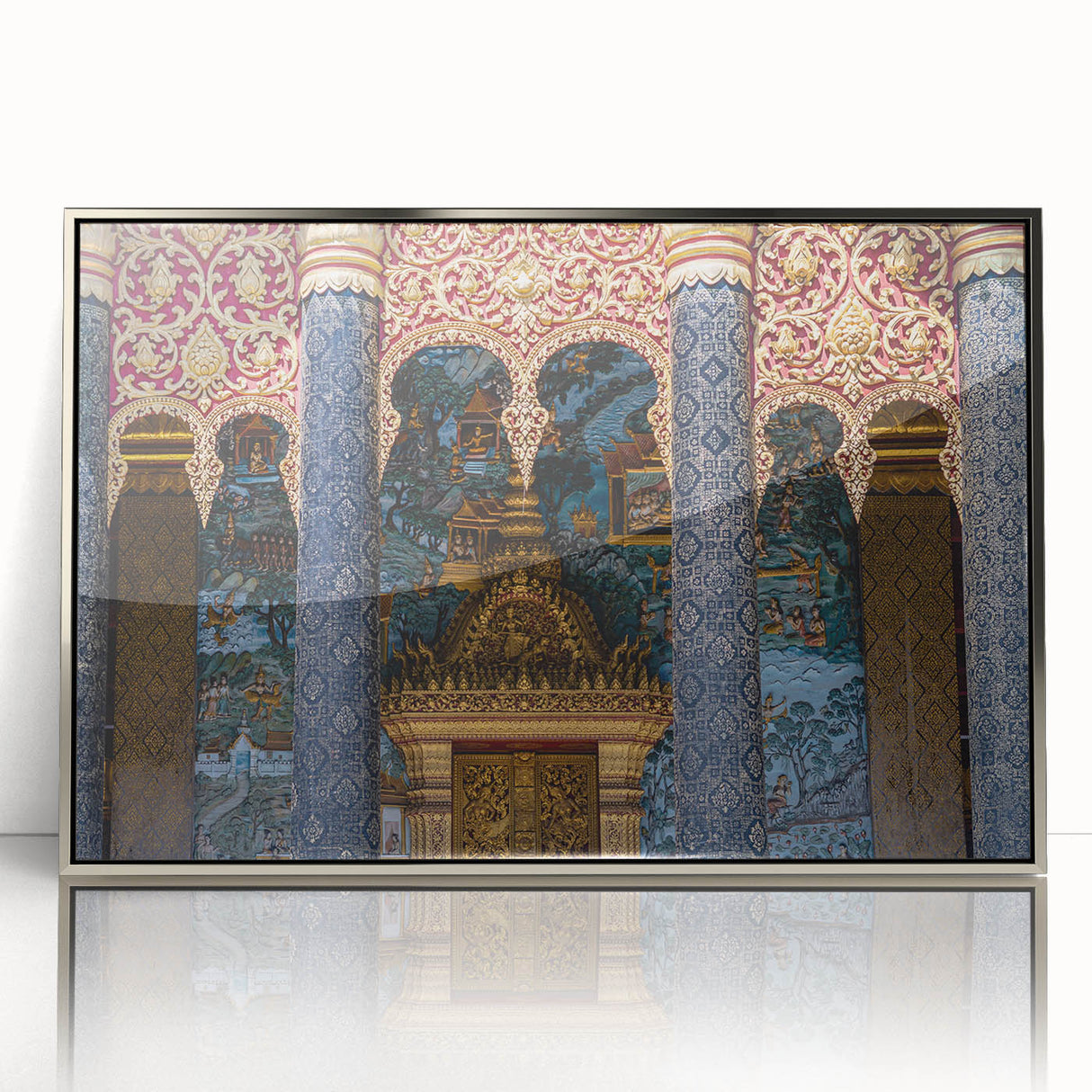 Mid-century modernist art depicting a serene Laotian landscape in soft blue and green hues, framed in silver acrylic.
