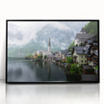 Large abstract wall art depicting a stylized European landscape in muted earth tones, framed in black acrylic.