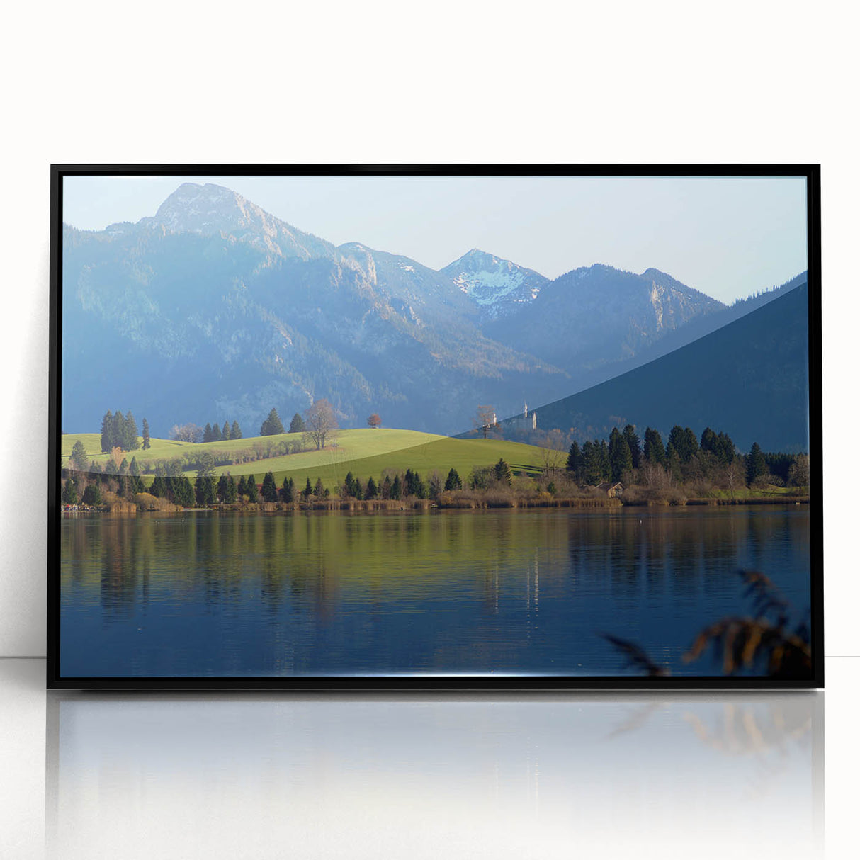Large abstract wall art featuring a Bavarian landscape in muted gray and blue tones, framed in black acrylic.