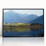 Large abstract wall art featuring a Bavarian landscape in muted gray and blue tones, framed in black acrylic.