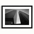 Abstract art print of a European scenery in vibrant colors on a large textured canvas, framed in black.