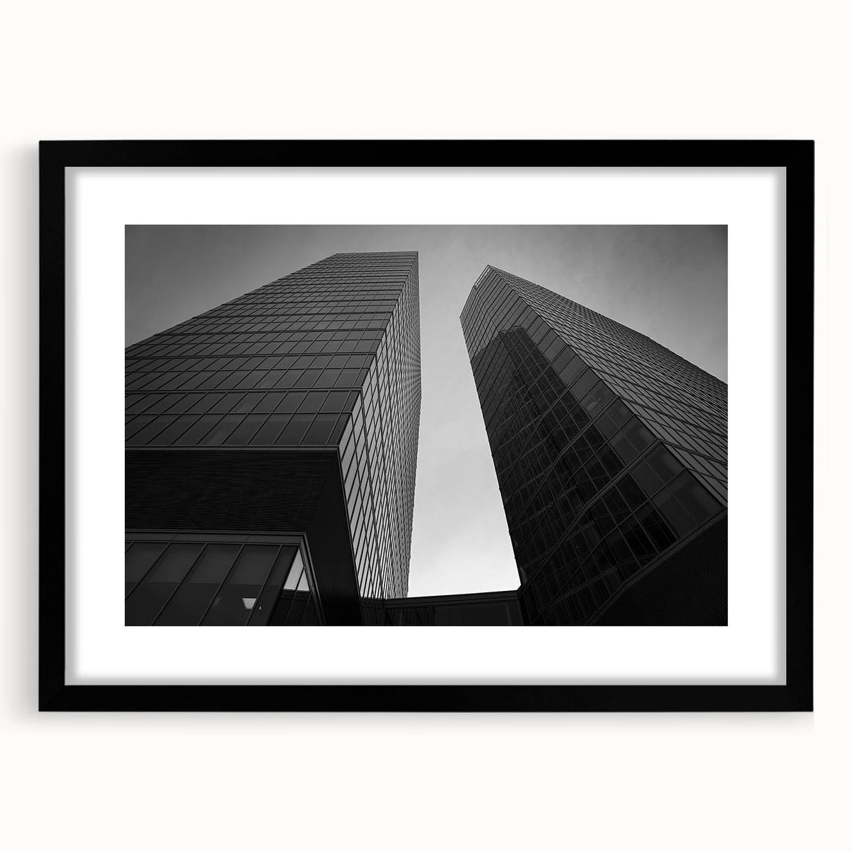 Abstract art print of a European scenery in vibrant colors on a large textured canvas, framed in black.