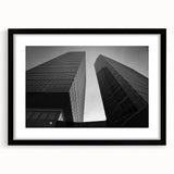 Abstract art print of a European scenery in vibrant colors on a large textured canvas, framed in black.