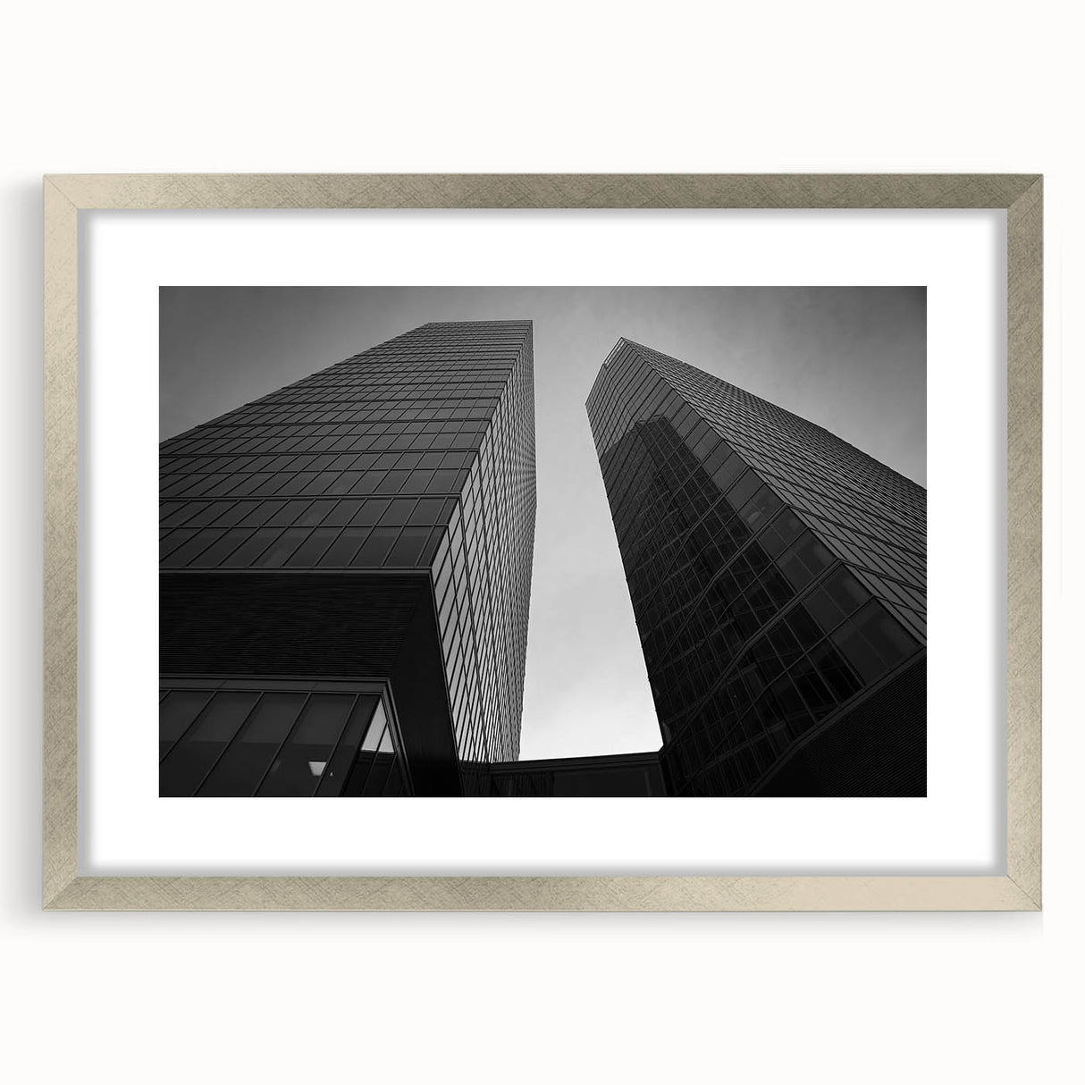 Extra large abstract art print of a textured European scenery in muted earth tones, framed in silver.