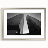Extra large abstract art print of a textured European scenery in muted earth tones, framed in silver.