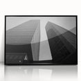 Large abstract wall art depicting a European cityscape in muted gray and blue tones on framed acrylic.