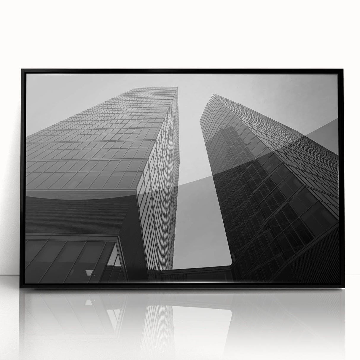 Large abstract wall art depicting a European cityscape in muted gray and blue tones on framed acrylic.