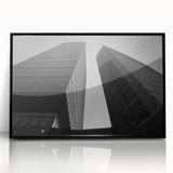 Large abstract wall art depicting a European cityscape in muted gray and blue tones on framed acrylic.