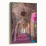 Framed canvas featuring a vintage-style landscape painting of a Middle Eastern scenery, with muted gold and black tones.
