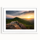 Abstract art print depicting rolling Kentucky landscapes in muted earth tones, framed with a white mat.
