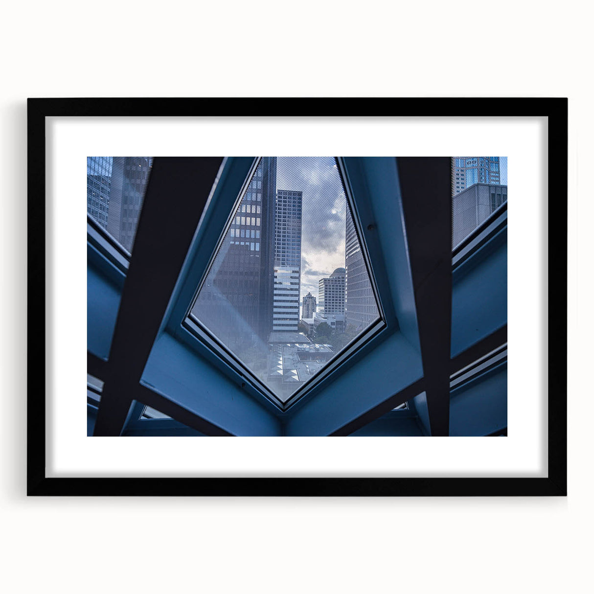 Colorful abstract art print of Seattle skyline, featuring vibrant hues on a large textured canvas.