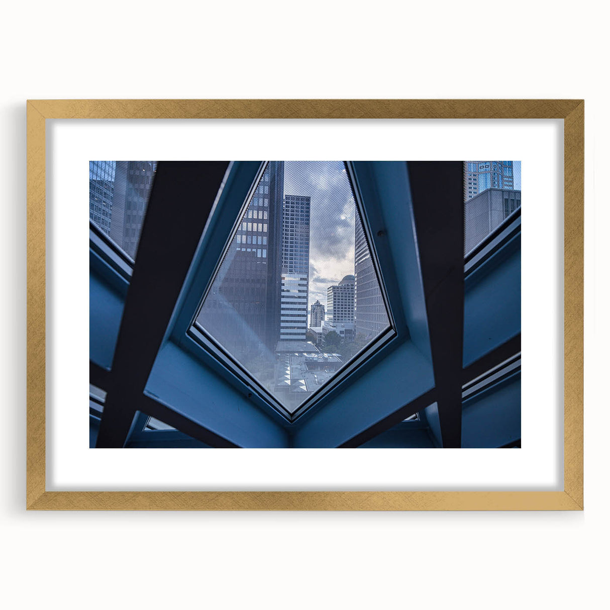 Extra large abstract art print of Seattle skyline in textured gold frame, muted earth tones, ideal for living room decor.