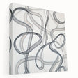 Abstract geometric stretched canvas artwork showcasing vibrant blue and orange shapes with a modern design, ideal for contemporary home decor.