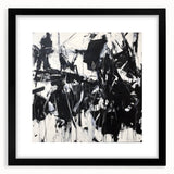 Black-framed abstract art print featuring colorful splatter designs, set against a white mat background, ideal for modern home decor and gallery displays.