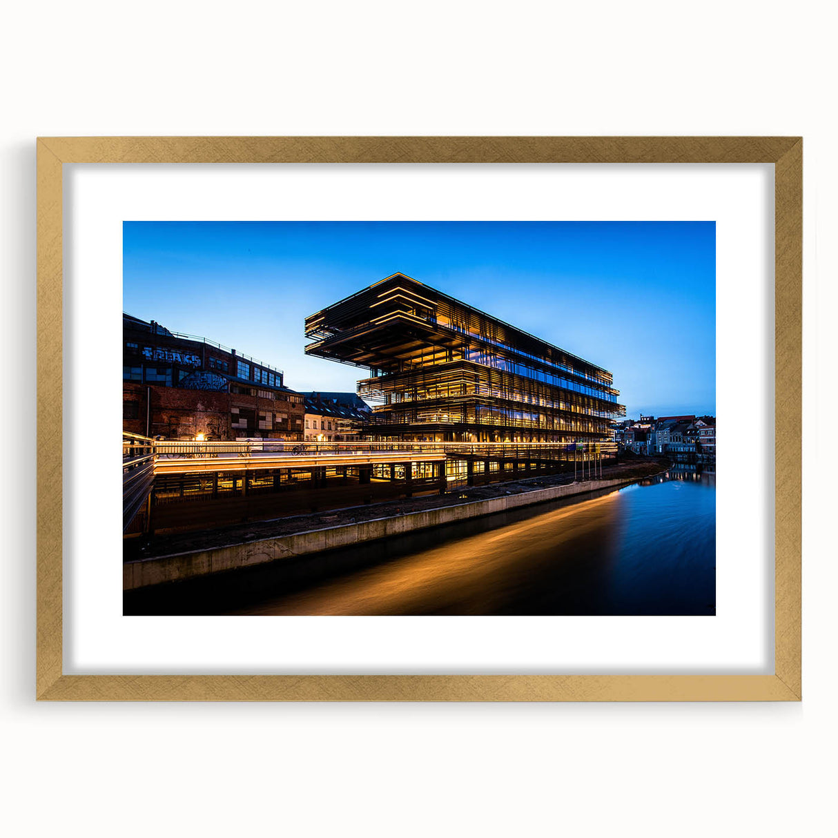 Abstract art print depicting a European scenery in gold frame with mat, ideal for dining room decor.