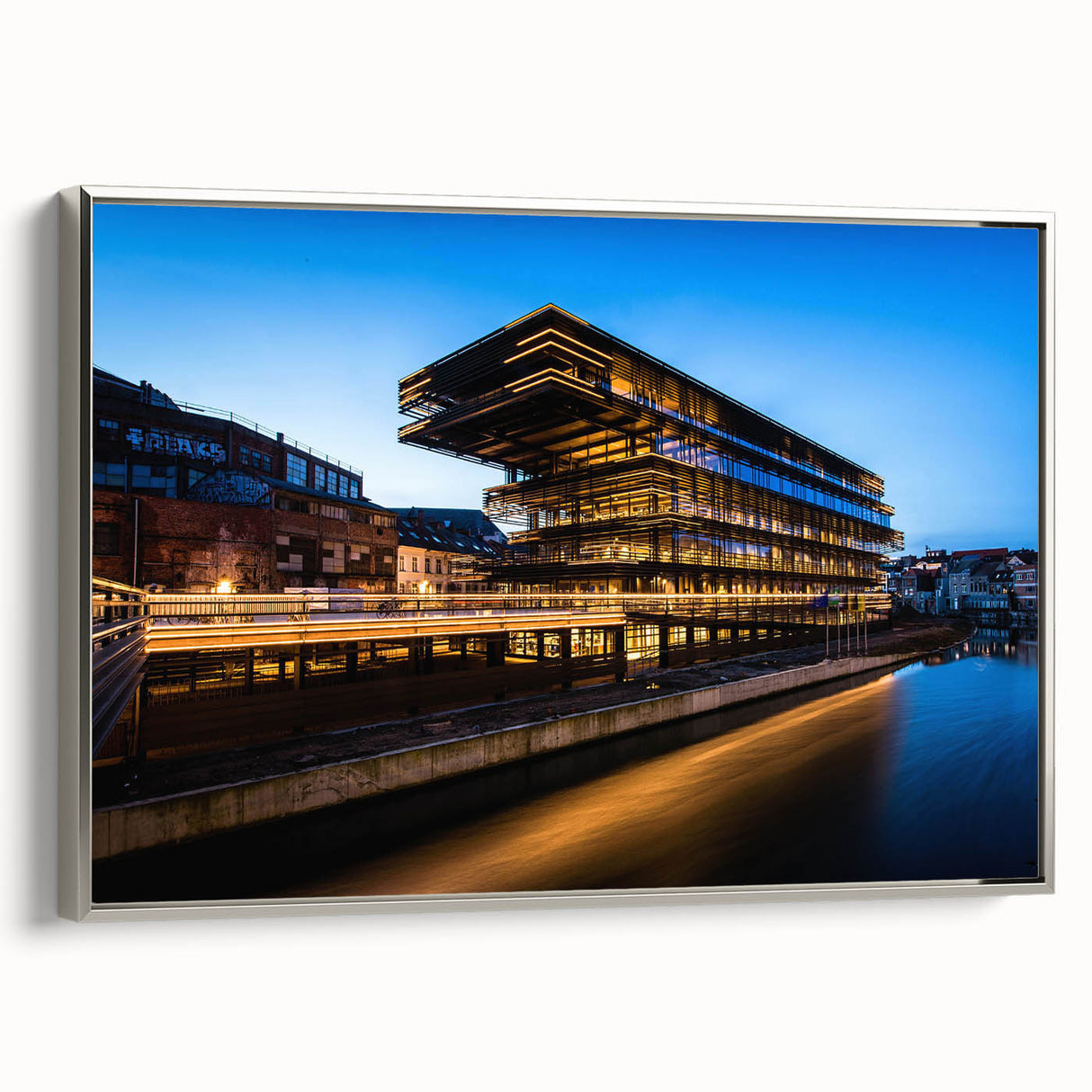 Landscape art painting featuring a vintage European scene in vibrant colors on a black framed canvas.