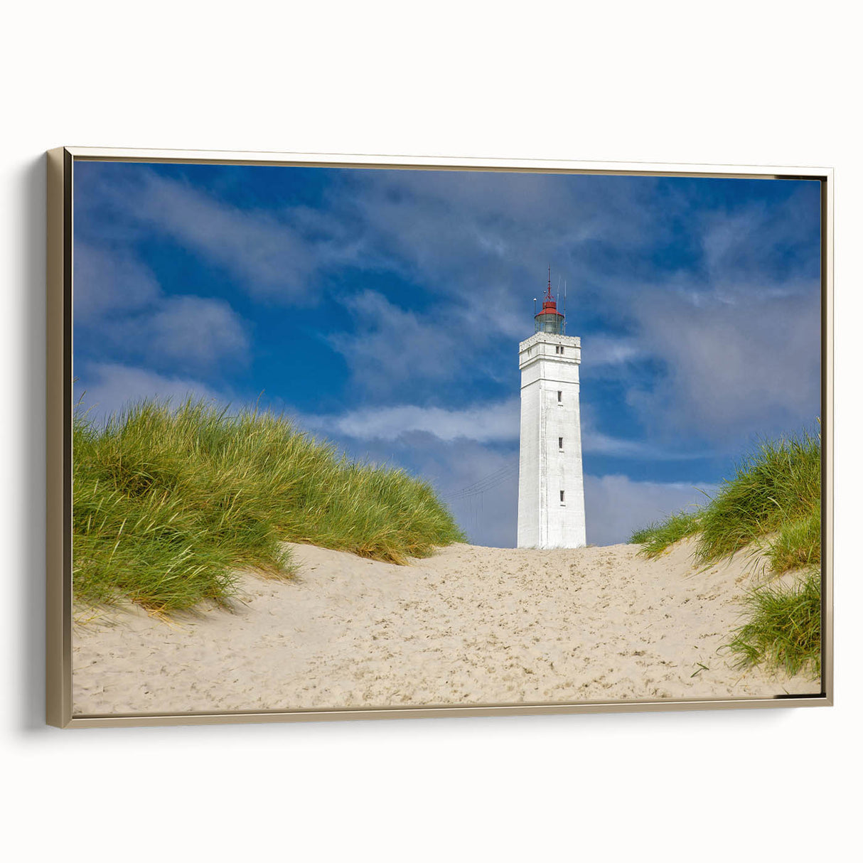 Framed canvas featuring a vintage-style landscape painting of a European scenery in muted gold and black tones.