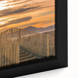 Extra large framed canvas featuring a textured depiction of a vibrant European village in black with colorful accents.