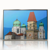 Large art print of a Bavarian landscape in muted green and blue tones, framed in silver acrylic.