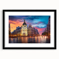 Colorful abstract art print of Madrid scenery in vibrant hues on a large textured canvas, framed in black.