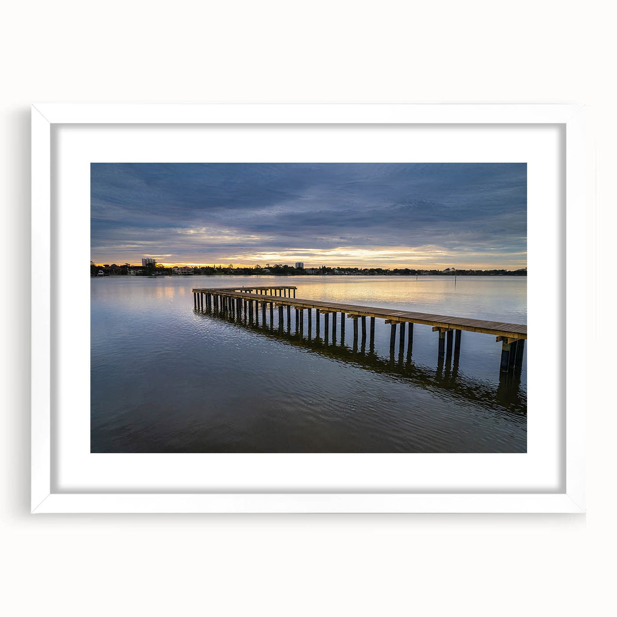 Abstract art print featuring Daytona scenery in muted blue and green tones on a white framed canvas.