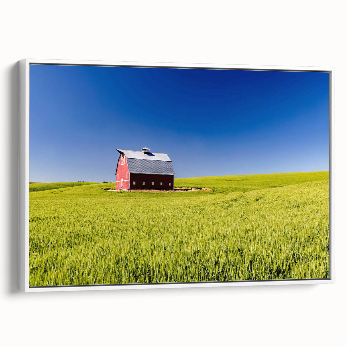 Vintage poster art of Idaho scenery on a large framed canvas, featuring colorful art against a black background.