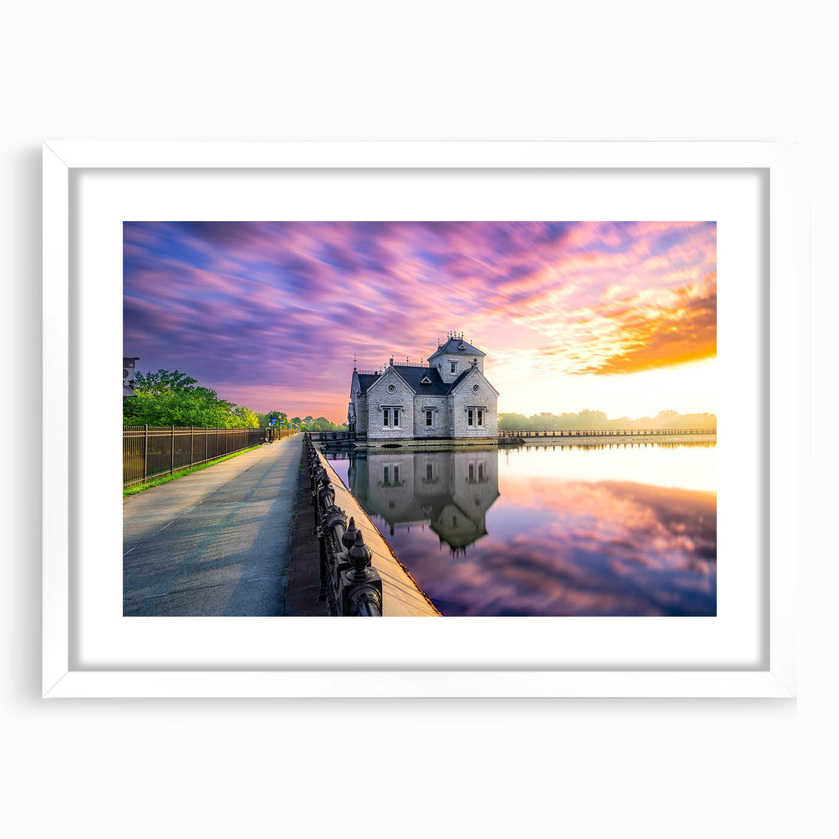 Abstract art print of Kentucky scenery in muted green and blue tones, framed with a white mat.