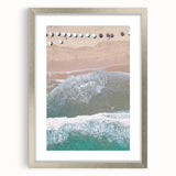 Textured abstract art print in soft gray and white, framed in silver, ideal for modern bedroom ambiance.