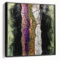 Framed canvas artwork showcasing an abstract floral design with vibrant colors, set against a sleek black frame, perfect for modern home decor.