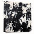Abstract acrylic glass artwork featuring colorful splatters, displayed from a side view with visible pins, ideal for modern home decor or artistic settings.
