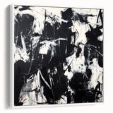 Framed canvas artwork showcasing an abstract design with colorful splatters on a white background, highlighting its modern aesthetic and vibrant hues. Ideal for contemporary home decor, this piece adds a pop of color and creativity to any space, making it a perfect choice for art enthusiasts looking to enhance their interiors.