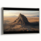 Framed canvas artwork depicting a serene desert landscape, featuring warm earth tones and intricate details, set in a sleek silver frame, ideal for modern home decor.