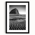 Framed landscape art print showcasing serene sand dunes in warm tones, set in a sleek black frame with a white mat, perfect for modern home decor.