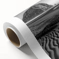 Rolled canvas showcasing a stunning desert landscape featuring golden dunes and a vibrant sunset, designed for wall art decor, elegantly packed in a protective tube.