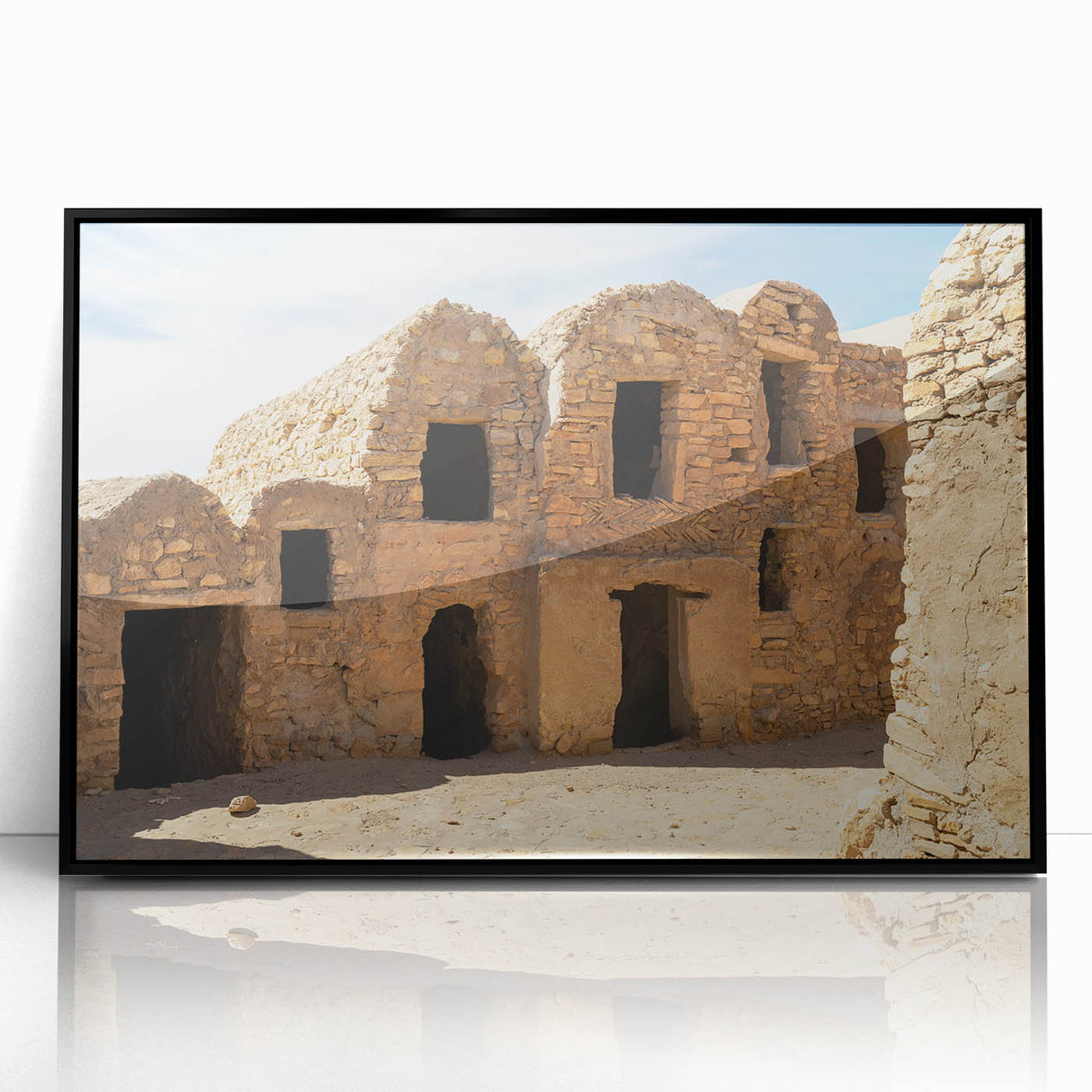 Large abstract wall art depicting a Moroccan landscape in muted earth tones on a framed acrylic.