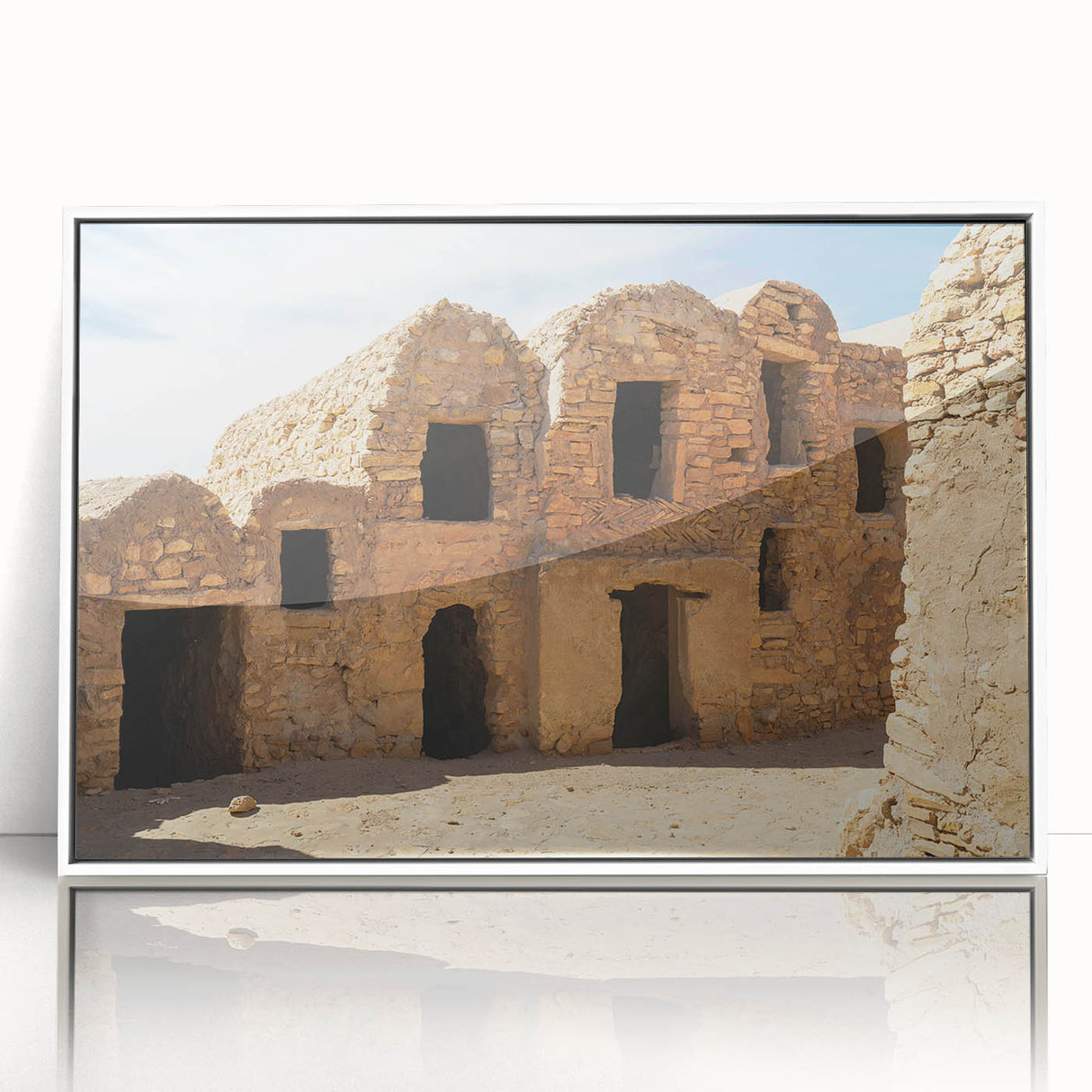 Mid-century modernist art depicting a Moroccan landscape in muted earth tones on a framed acrylic.