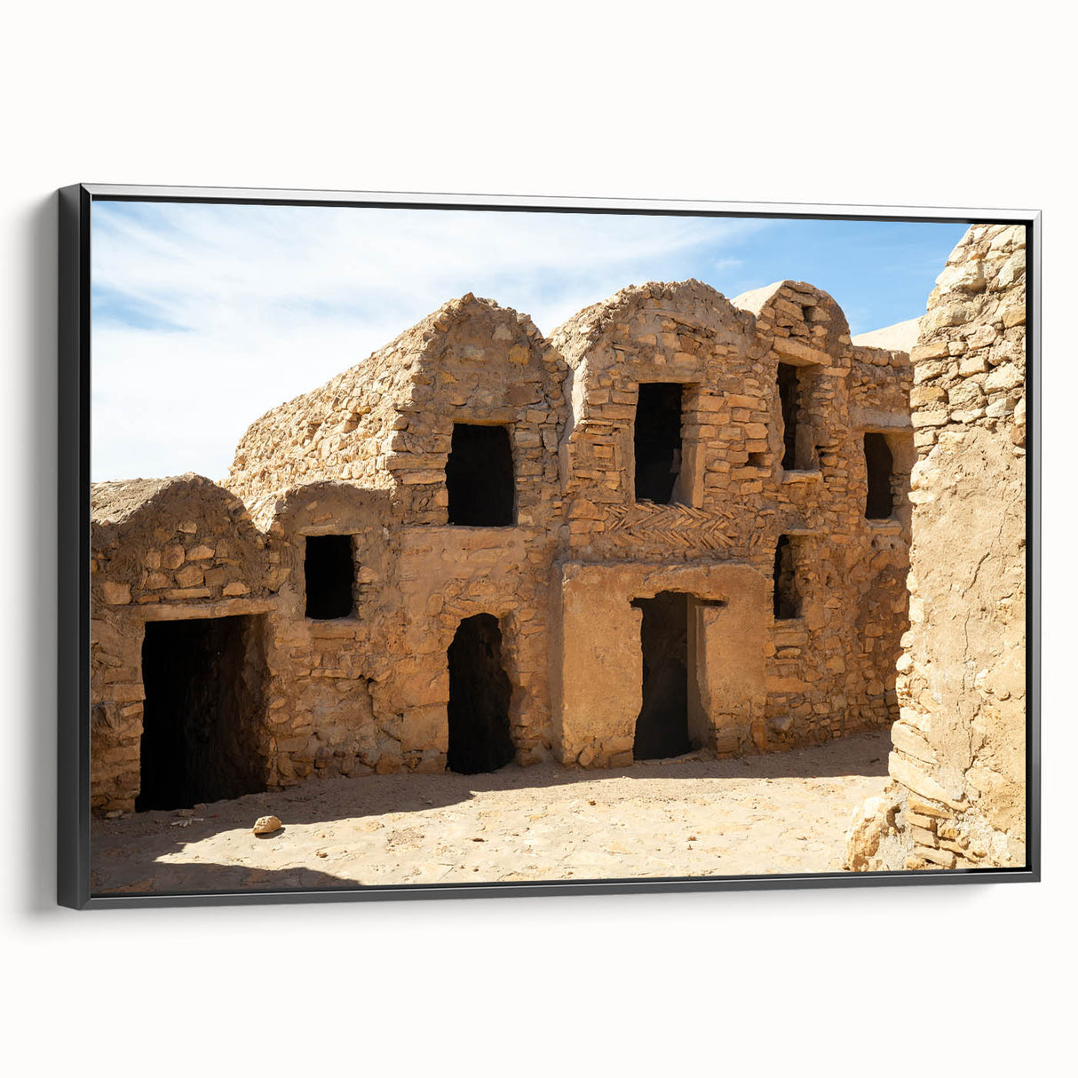 Black and white framed canvas of a Moroccan landscape, ideal for bedroom wall art, featuring vintage poster style.