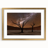 Textured art print of an abstract African landscape in muted earth tones, framed in gold, ideal for bedroom decor.