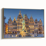 Framed canvas featuring a vintage-style landscape painting of a European scenery in muted gold and black tones.