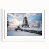 Textured art print of abstract European scenery in muted earth tones, framed with a white mat, suitable for bedroom decor.