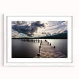 Textured art depicting abstract European landscape in muted earth tones on a framed white mat, ideal for bedroom decor.
