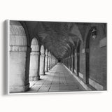 Vintage poster art of Madrid scenery on a framed canvas, featuring colorful artwork against a black background.